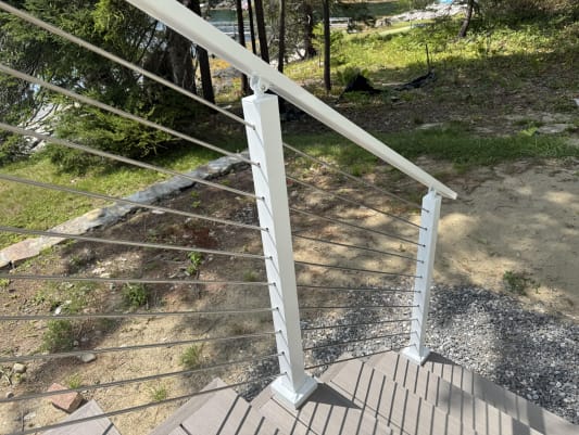 White cable railing on deck stair