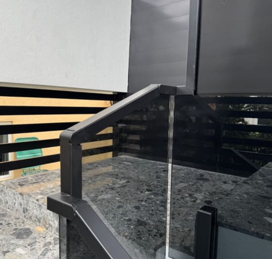 Glass railing cap rail fitting detail