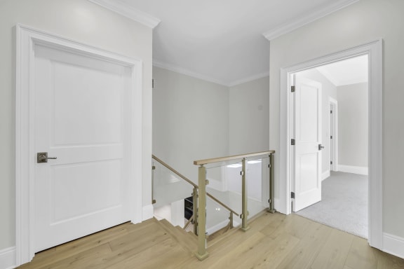 Landing with brass posts and glass