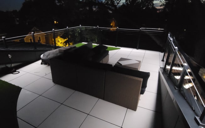 Rooftop cable railing at night