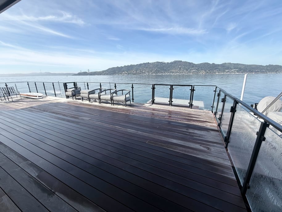 Glass railing on waterfront Ipe deck